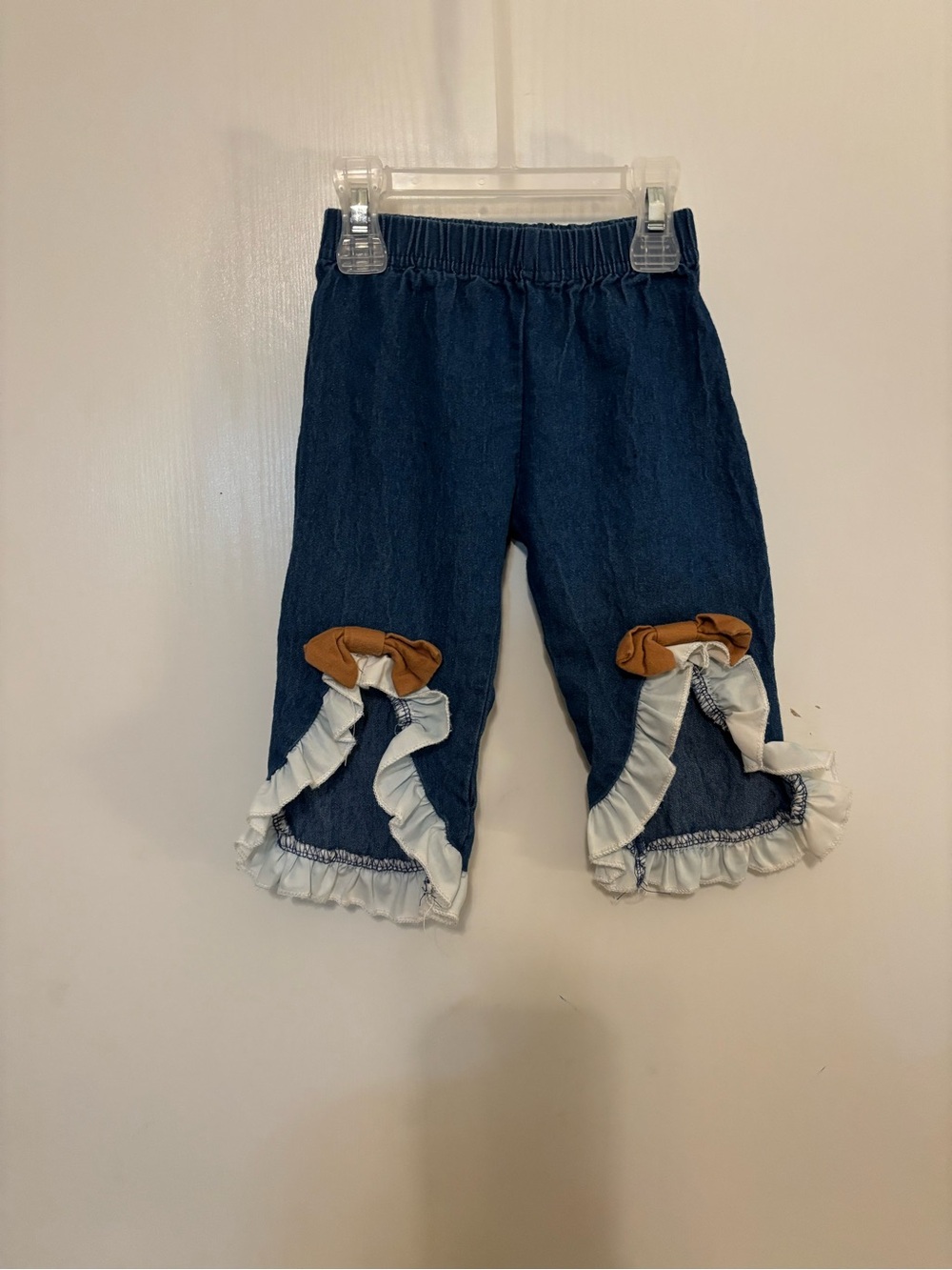 Girls' Dark Blue Ruffle Hem Jeans with Tan Bow Accent